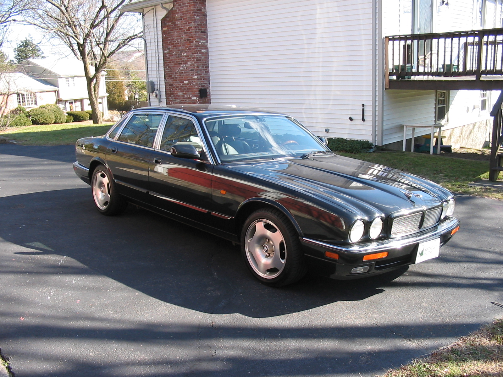 black 1995 jaguar xjr in my driveway